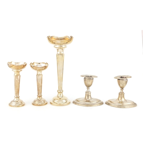 216 - Two pairs of silver candlesticks and one other, various Birmingham and Sheffield hallmarks, the larg... 