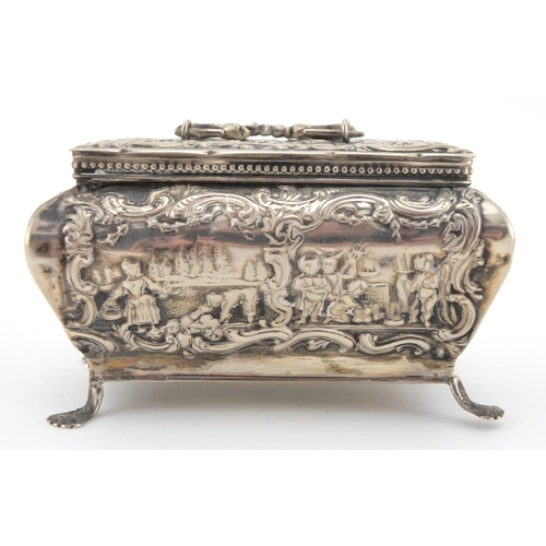 179 - Continental silver Bombay chest shaped trinket with hinged lid, embossed with farmeing scenes, impre... 