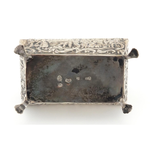 179 - Continental silver Bombay chest shaped trinket with hinged lid, embossed with farmeing scenes, impre... 