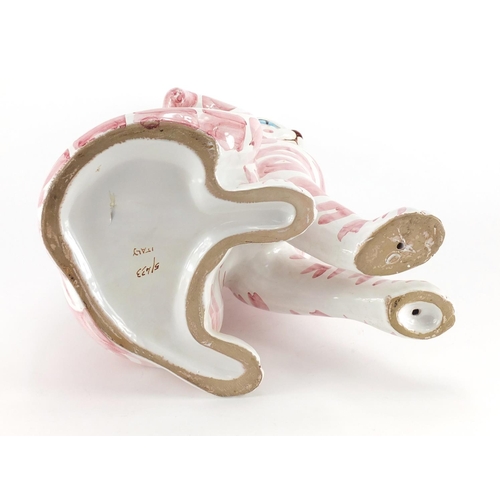 1003 - Large Italian faience glazed pottery cat, hand painted in pink, painted marks and Phillips label to ... 