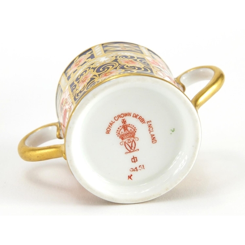 819 - Miniature Royal Crown Derby Imari twin handled loving cup and a saucer, each with factory marks to t... 