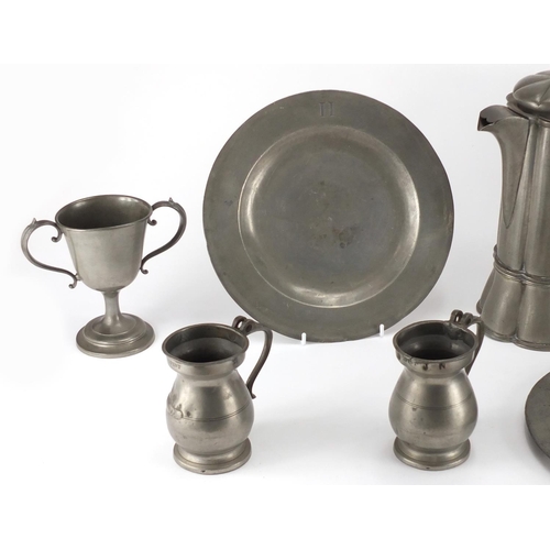 98 - Antique pewter including a lidded jug with hexagonal lobed body and two tankards, various impressed ... 