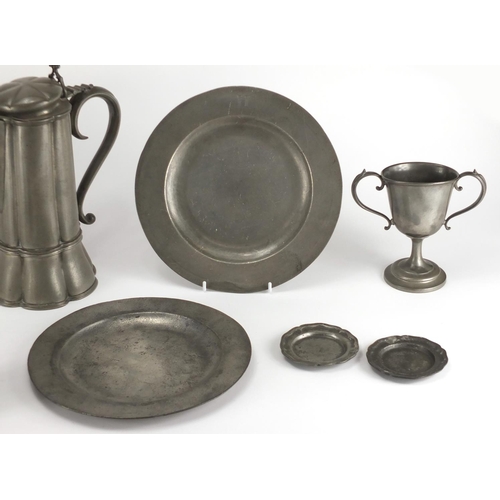 98 - Antique pewter including a lidded jug with hexagonal lobed body and two tankards, various impressed ... 