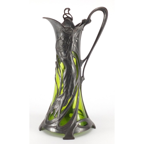 1019 - Art Nouveau pewter and green glass lined ewer by WMF, the pewter body cast with a stylised maiden, i... 