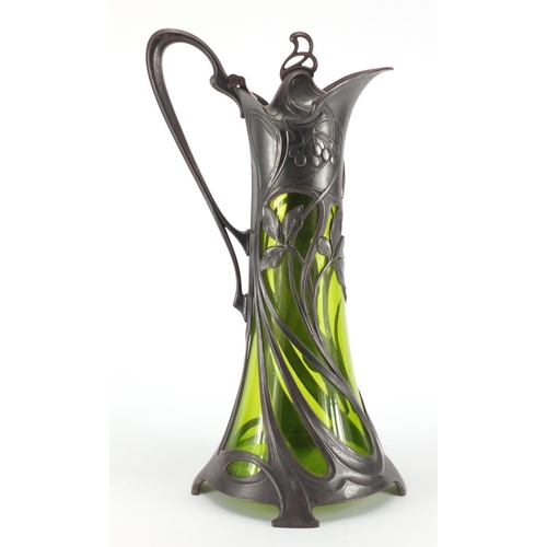 1019 - Art Nouveau pewter and green glass lined ewer by WMF, the pewter body cast with a stylised maiden, i... 