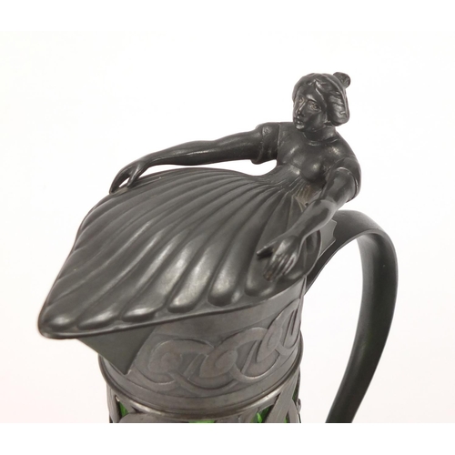 1020 - Art Nouveau pewter and green glass lined ewer in the style of WMF, the pewter body cast with stylise... 