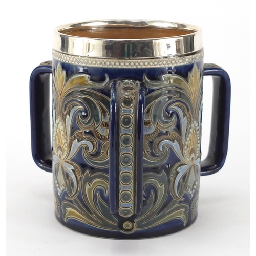 958 - Art Nouveau Doulton Lambeth tyg with silver mounted rim, hand painted and incised with stylised flow... 