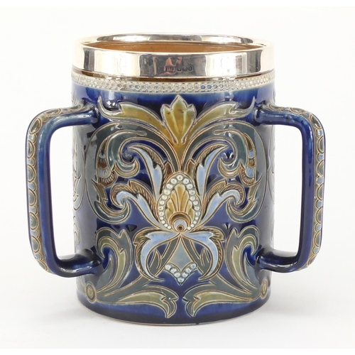 958 - Art Nouveau Doulton Lambeth tyg with silver mounted rim, hand painted and incised with stylised flow... 