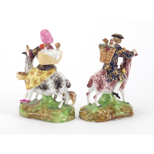 813 - Pair of 19th century Derby porcelain figures on goats, painted marks to the base, the largest 12.5cm... 