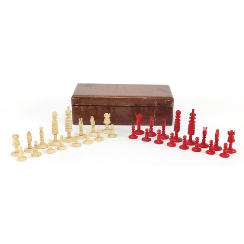 502 - 19th century part stained carved bone chess set, the largest piece 6.5cm high