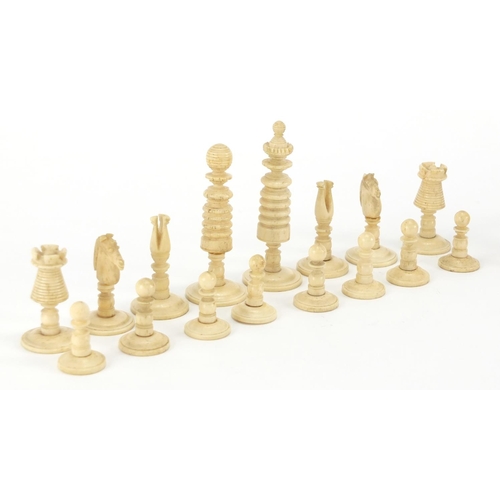 502 - 19th century part stained carved bone chess set, the largest piece 6.5cm high