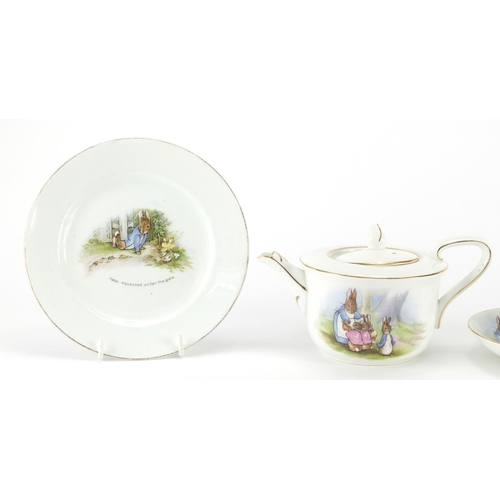 978 - Peter Rabbit nursery teaware by Grimwades comprising teapot, two cups, a saucer and side plate, the ... 