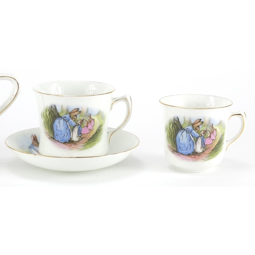 978 - Peter Rabbit nursery teaware by Grimwades comprising teapot, two cups, a saucer and side plate, the ... 