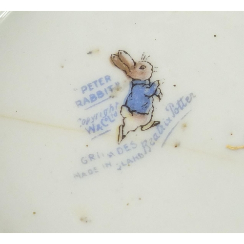 978 - Peter Rabbit nursery teaware by Grimwades comprising teapot, two cups, a saucer and side plate, the ... 