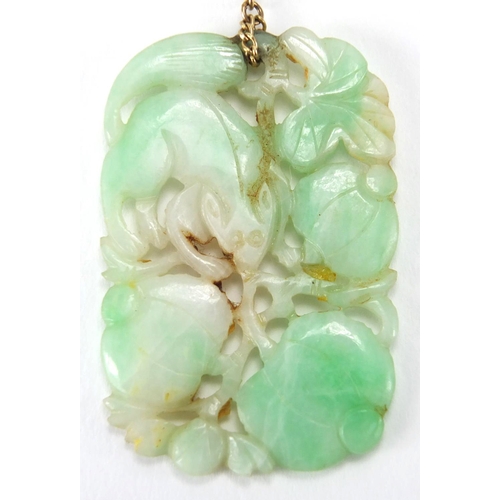 695 - Chinese 9ct gold and green jade jewellery comprising a pendant carved with a mythical creature and f... 