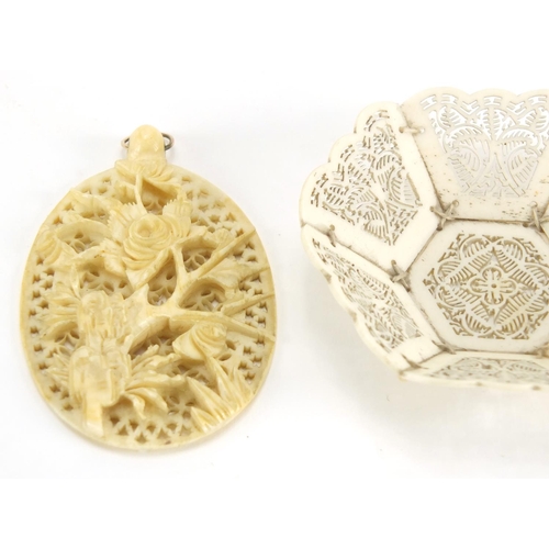 720 - Oriental ivory and bone including a Chinese Canton panel, Japanese Ojime and a hexagonal pierced bon... 