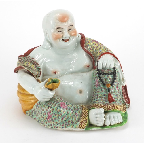 570 - Chinese porcelain figure of Buddha holding a sack, finely hand painted in the famille rose palette, ... 