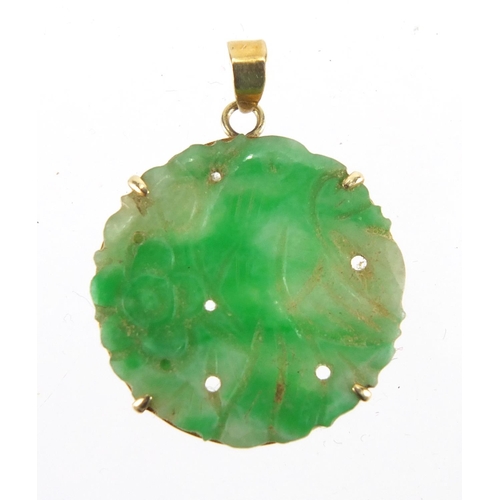 696 - Chinese 14ct gold and green jade pendant carved with a flower, 2cm in diameter, approximate weight 2... 