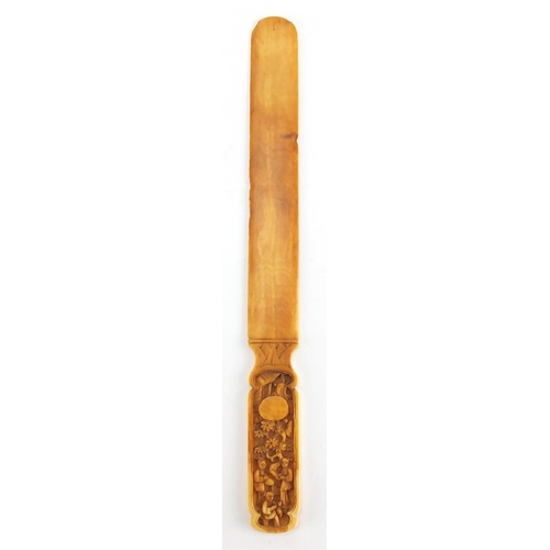 714 - Chinese Canton ivory page turner, the handle carved with figures, 19cm in length