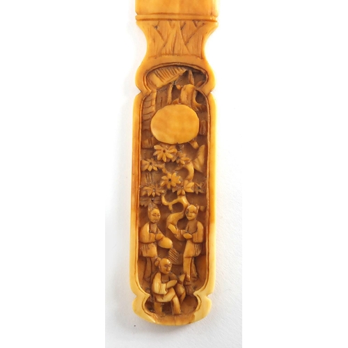714 - Chinese Canton ivory page turner, the handle carved with figures, 19cm in length