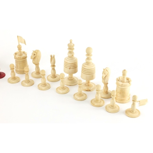 501 - Part 19th century half stained carved bone chess set, the largest piece 10cm high