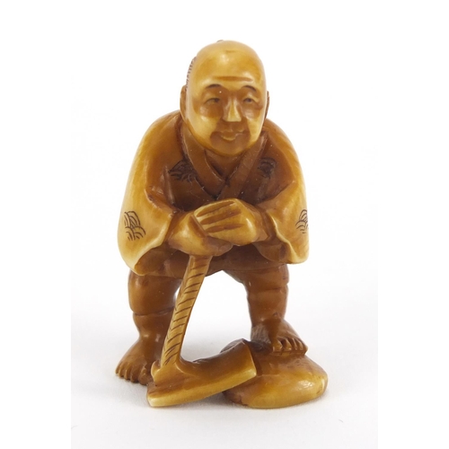 718 - Japanese carved ivory Netsuke of a fisherman, character marks to the base, 4.5cm high