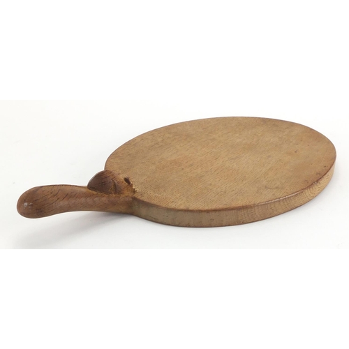 1042 - Robert Thompson Mouseman oak cheese board carved with a signature mouse, 38cm in length