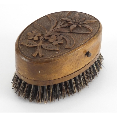 65 - Novelty Black Forest musical brush carved with flowers, 10.5cm wide