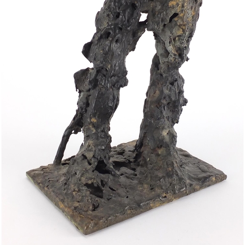 1016 - Craig Hudson - Modernist patinated bronze sculpture of a standing figure, 52.5cm high