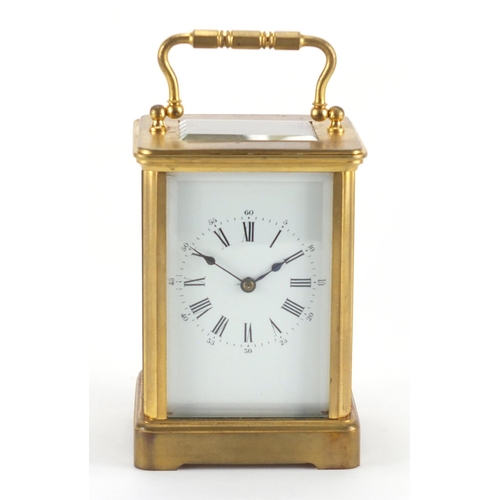 1276 - Gilt brass carriage clock with enamelled dial, Roman numerals and velvet lined case, the back plate ... 