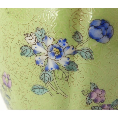 573 - Chinese green ground vase with naturalistic relief decoration, hand painted in the famille rose pale... 