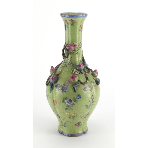 573 - Chinese green ground vase with naturalistic relief decoration, hand painted in the famille rose pale... 