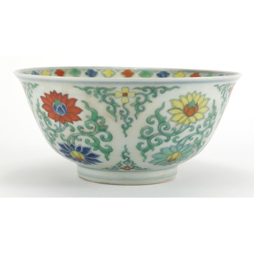 576 - Chinese Doucai porcelain bowl, hand painted with lotus flowers amongst foliate scrolls, six figure c... 