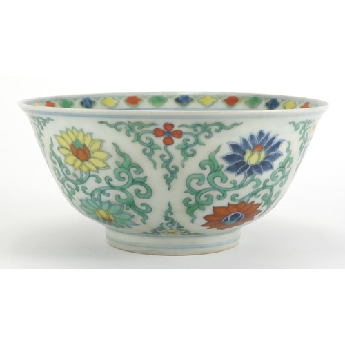 576 - Chinese Doucai porcelain bowl, hand painted with lotus flowers amongst foliate scrolls, six figure c... 