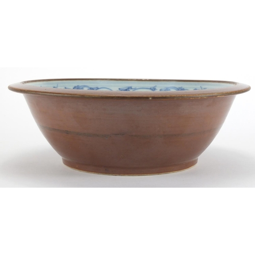 545 - Chinese brown glazed blue and white porcelain basin, the interior hand painted with foliate motifs, ... 