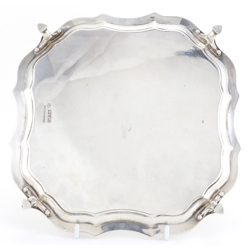 221 - Square silver four footed salver with hoof feet, indistinct makers mark, Chester 1912, 21cm x 21cm, ... 