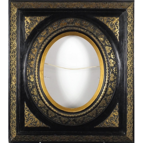 1524 - Carved black and gilt painted frame, with oval aperture, overall 54cm x 47.5cm