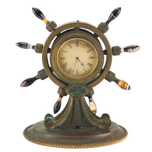 1265 - 19th century gilt bronze ships wheel design clock, with agate handles and Roman numerals, 24.5cm hig... 