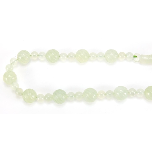 703 - Chinese pale green jade bead necklace, housed in a velvet lined box, 62cm in length