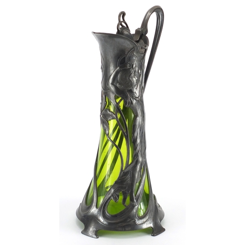 1019 - Art Nouveau pewter and green glass lined ewer by WMF, the pewter body cast with a stylised maiden, i... 