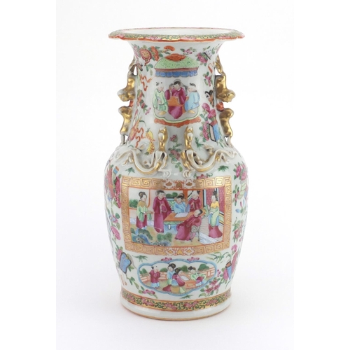 569 - Chinese porcelain Canton vase with twin handles and relief dragon decoration, finely hand painted in... 