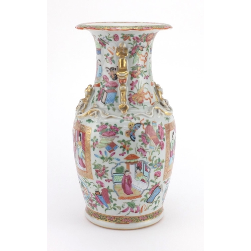 569 - Chinese porcelain Canton vase with twin handles and relief dragon decoration, finely hand painted in... 