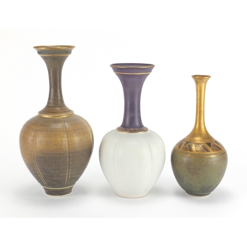 989 - Three Bridget Drakeford Studio pottery vases, each hand gilded and with incised marks around the rim... 