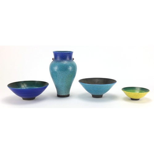 996 - Peter Sparrey raku studio pottery comprising three bowls and a vase, impressed marks to the bases, t... 