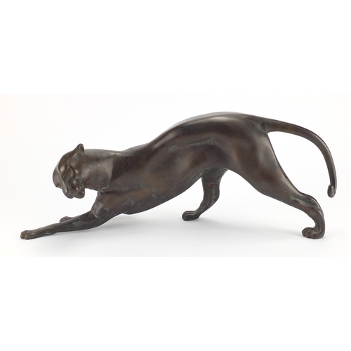 1018 - Modernist patinated bronze study of a crouching leopard, 53cm in length