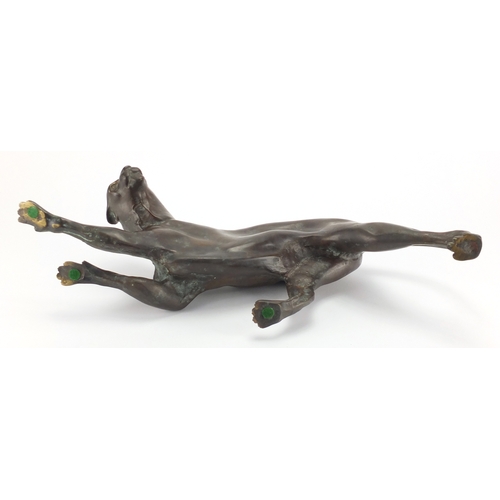 1018 - Modernist patinated bronze study of a crouching leopard, 53cm in length