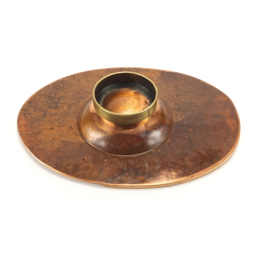 1035 - Sam Fanaroff oval copper and brass dish having an applied flower design, set with a green cabochon, ... 