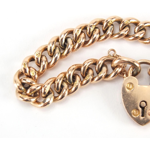 1066 - 9ct gold bracelet with love heart shaped padlock, 16cm in length, approximate weight 13.8g