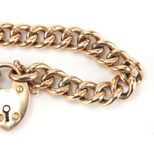 1066 - 9ct gold bracelet with love heart shaped padlock, 16cm in length, approximate weight 13.8g