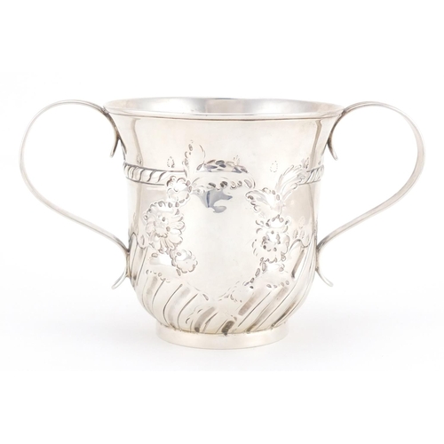 183 - 18th century silver twin handled loving cup with embossed demi fluted decoration and blank cartouche... 